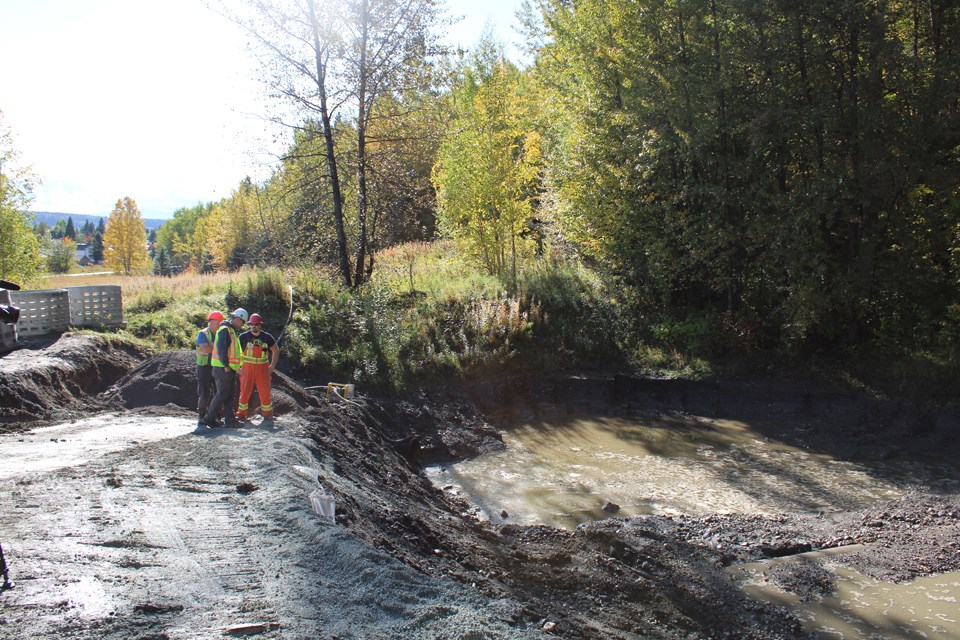 A detention pond allows water to settle out dirt and debris before it flows out to the rivers. 