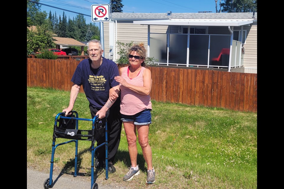 Dawson Road residents Bill Harkness and Lynn Blatta have raised concerns about lack of enforcement of no-parking zone on street leading to Glenview Elementary School.