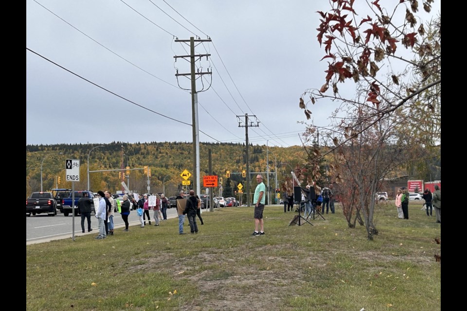 Protesters line Ferry Avenue ahead of SD57's Sept. 26 board meeting. 