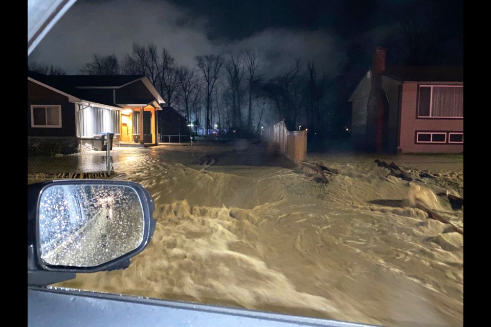 Merritt resident Jenny Pierce took this photo of the rising floodwaters surrounding her home as she left it early Monday morning.