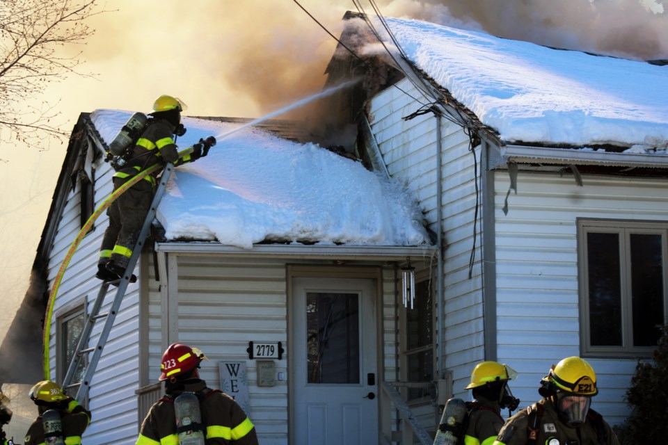house-fire-2779-merritt-road-fireman-from-front