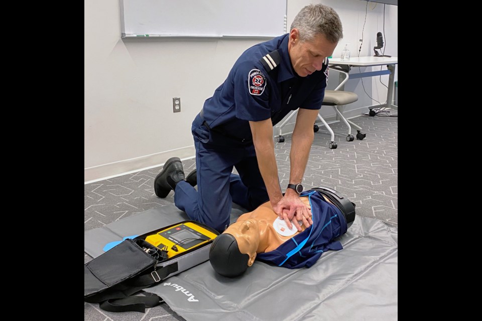 Prince George Fire Rescue captain Colin Groeneveld demonstrates CPR techniques at the No.1 fire hall on Massey Drive.