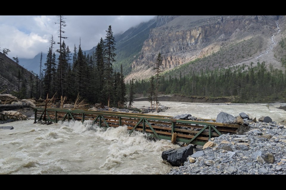 A bridge along the Berg Lake trail hit by high water and boulders during a flash flood on July 1.