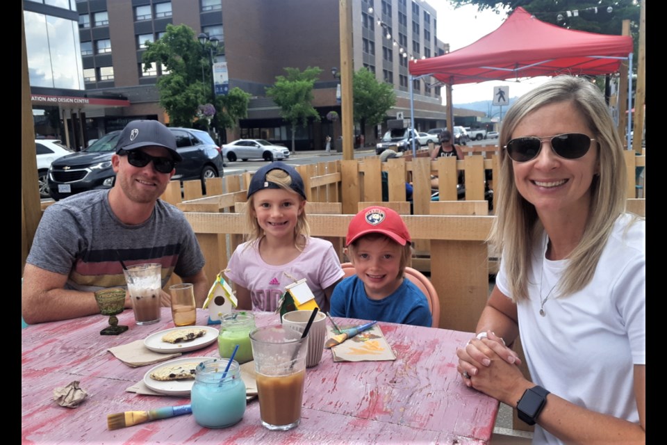 The Pederson family - Kevin, Claire, Parker and Lara -dropped by the streetside patio of The Makerie Cafe and Crafts on Fifth Avenue to take part in a little Summerfest Saturday activity.