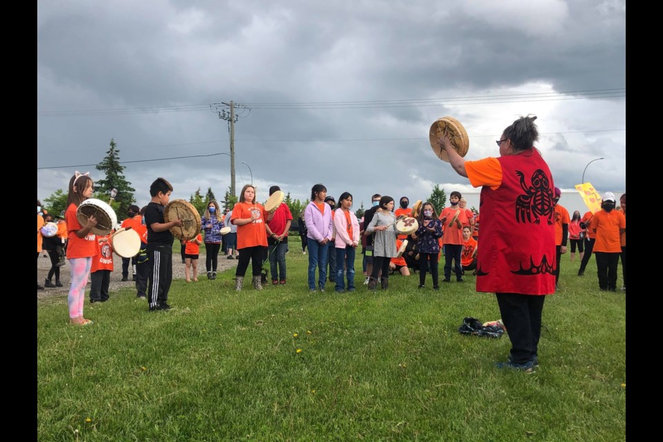 Hundreds gathered at the corner of Highway 16 and Ferry Avenue to honour 215 children discovered buried at Kamloops Residential School. 