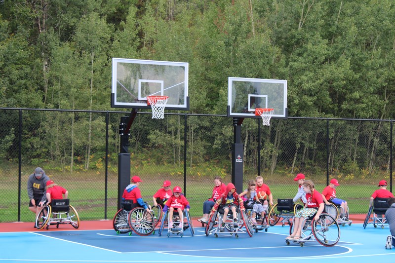 Kids enjoyed a game of wheelchair basketball during the opening celebration. 