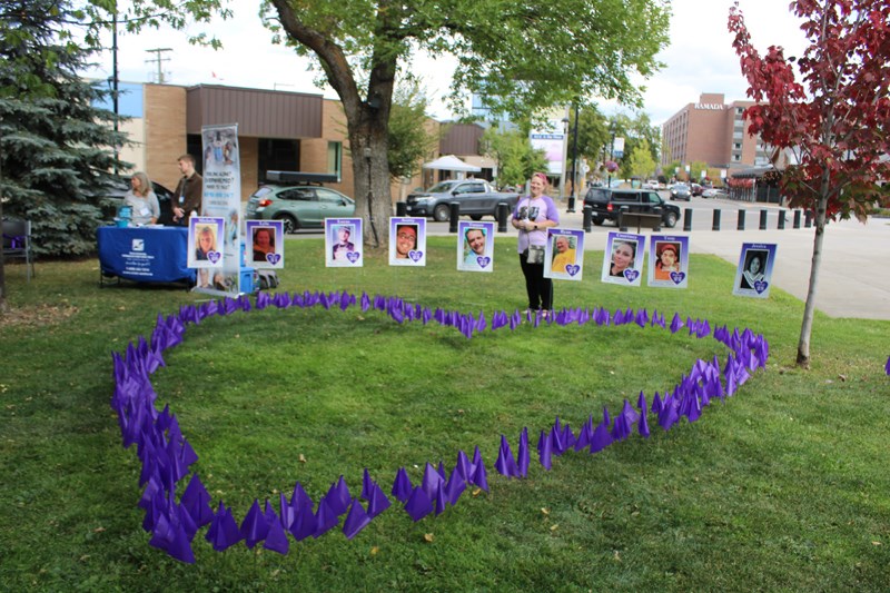 A purple heart was assembled to remember the lives lost. 