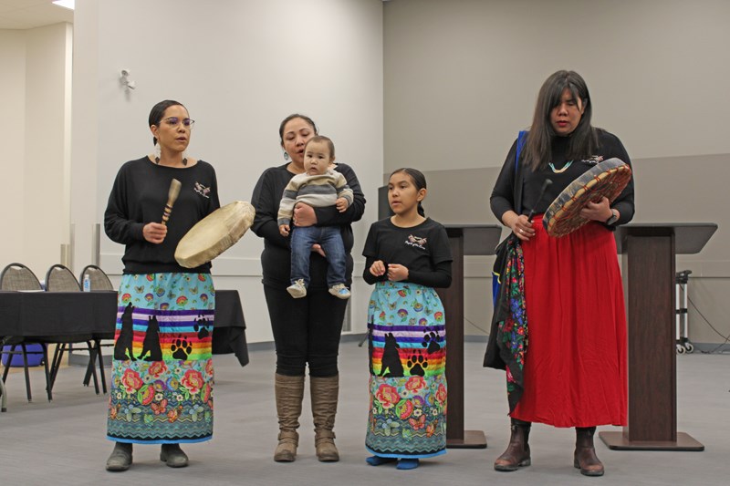 Simpcw drummers and singers perform during the ceremony. 