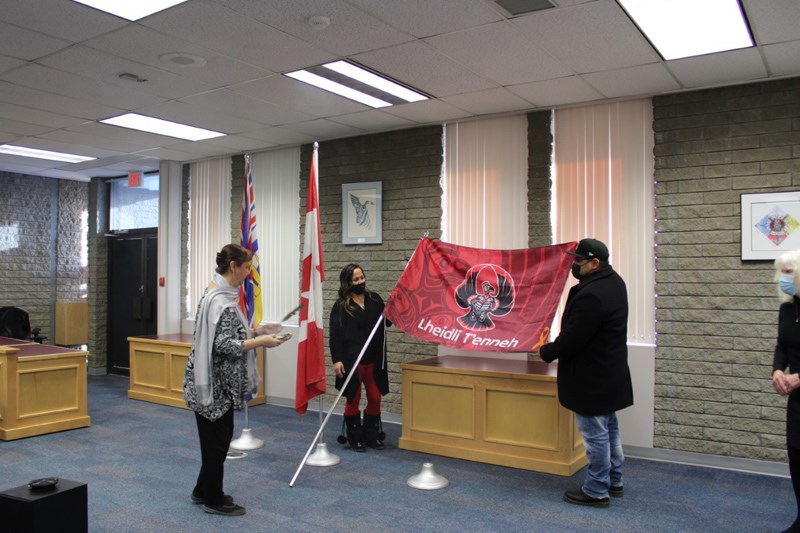 Lheidli T'enneh Elder Darlene McIntosh smudges the flag before it is raised. 