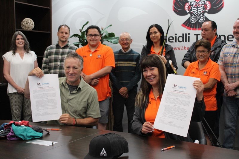 Caledonia Nordic Ski Club President Lance MacDonald and Lheildi T'enneh Chief Dolleen Logan sign the agreement. 