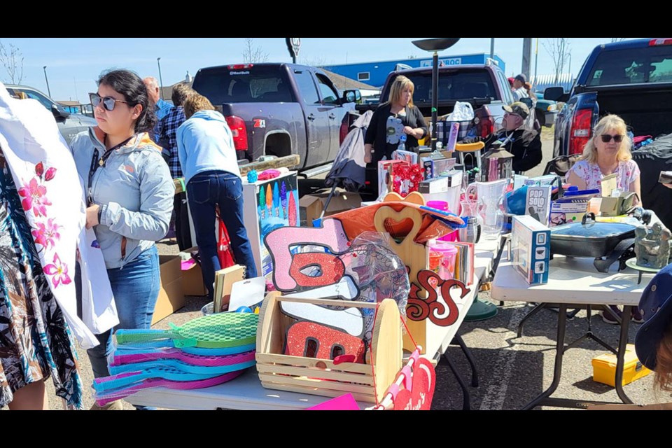 Signs of love were seen at REAPS Junk in the Trunk Sale Saturday at the CN Centre parking lot.
