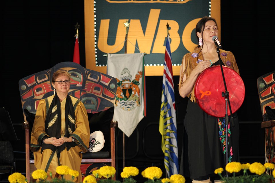 Before singing the song 'I Am', artist Kym Gouchie, took a moment to talk about the new UNBC Chancellor Darlene McIntosh, Lheidli T'enneh Elder, during the Installation Ceremony that took place Friday morning at the Northern Sport Centre.