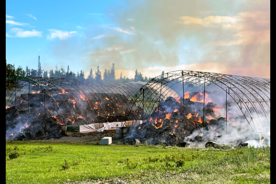 Fire burns two sheds loaded with hay on John Kochel's ranch west of Vanderhoof on Aug. 9.  An RCMP investigation has determined the fire was deliberately set. 