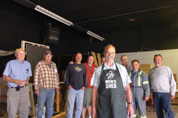 David Leslie stands with his Men's Shed companions in Vanderhoof which started in November 2014, as a therapeutic space for men to gather and work.