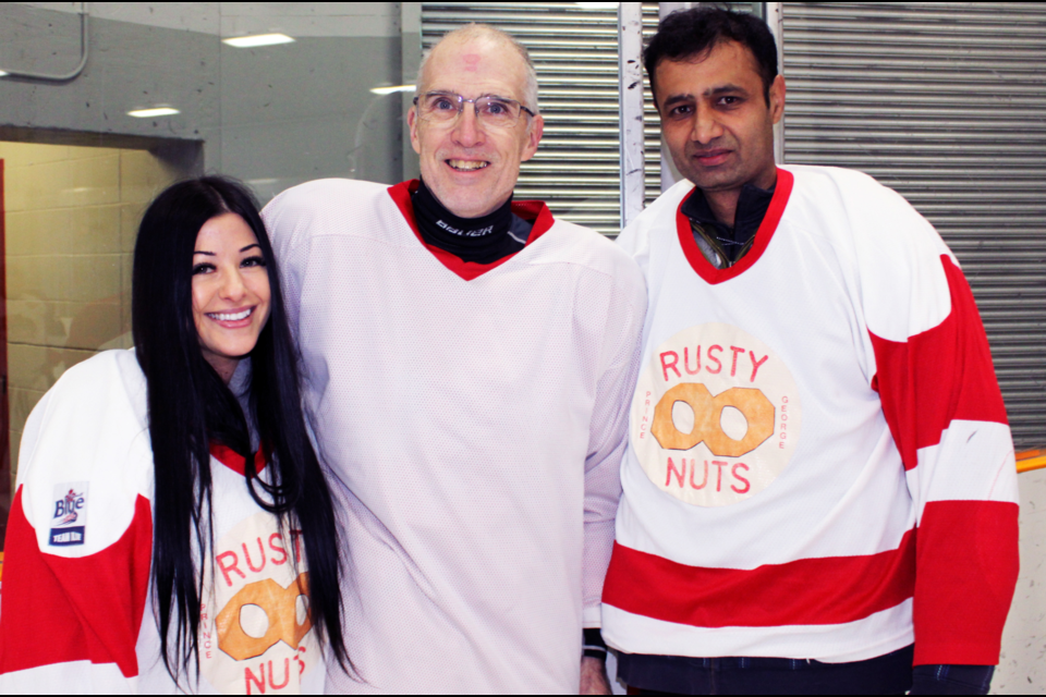Gord Fairbairn, middle, met City of Prince George arena staff members Jamie Shpak, left, and Onkar Parmar for the first time Friday morning. Shpak and Parmar helped keep Fairbairn alive back in April when he suffered a massive heart attack after a game at the Kin Centre.