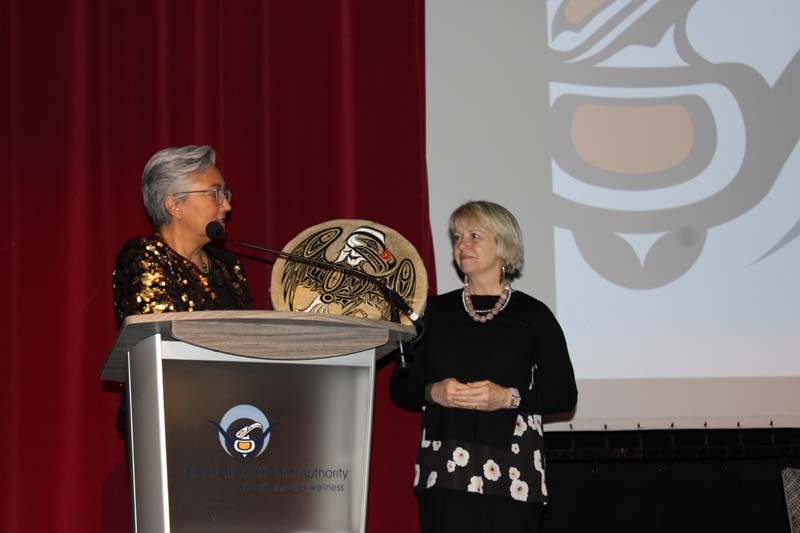 Public Health Officer Dr. Bonnie Henry is gifted with a drum for her work during the pandemic. 