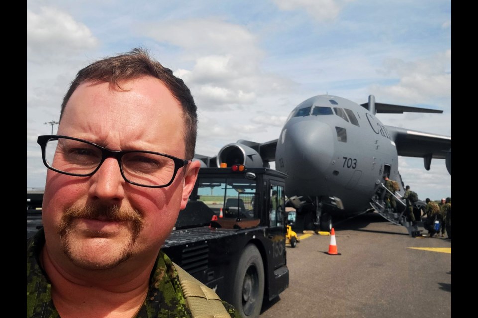 Cpl. Eamon McArthur of Prince George prepares to board a military jet in southern England. The Rocky Mountain Ranger officer served five months there this year on a deployment to train Ukrainian soldiers.