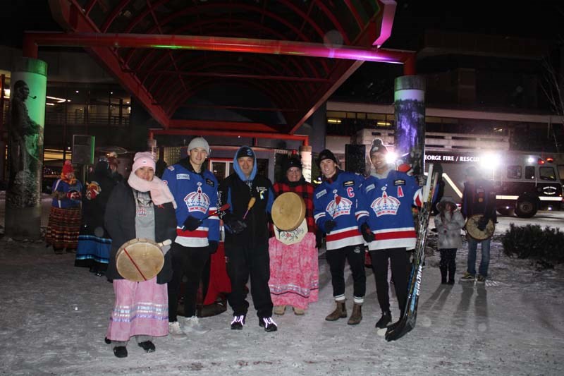 The Prince George Spruce Kings pose with the UHNBC drummers at the 2022 Civic Light Up. 