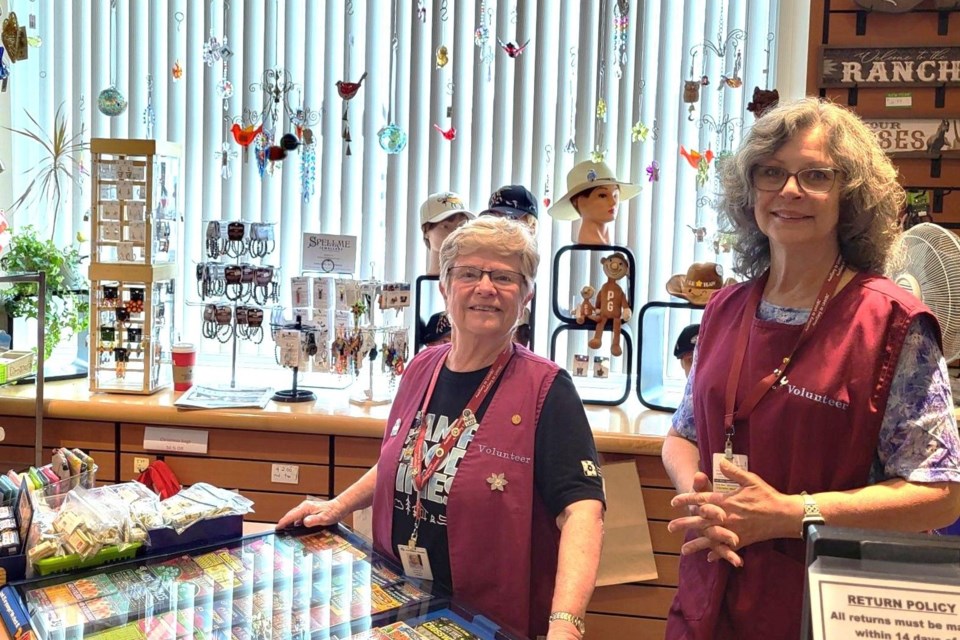 Auxiliary to UHNBC president Lindy Steele, left, and board member Debbie Page are seen behind the counter at the hospital's gift shop.