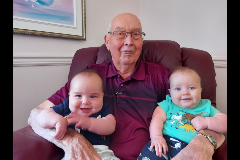 Allan Thorp, who turned 90 recently, sits with twins Levi and Gillis who are exactly to the day 89 and a half years younger than Allan.