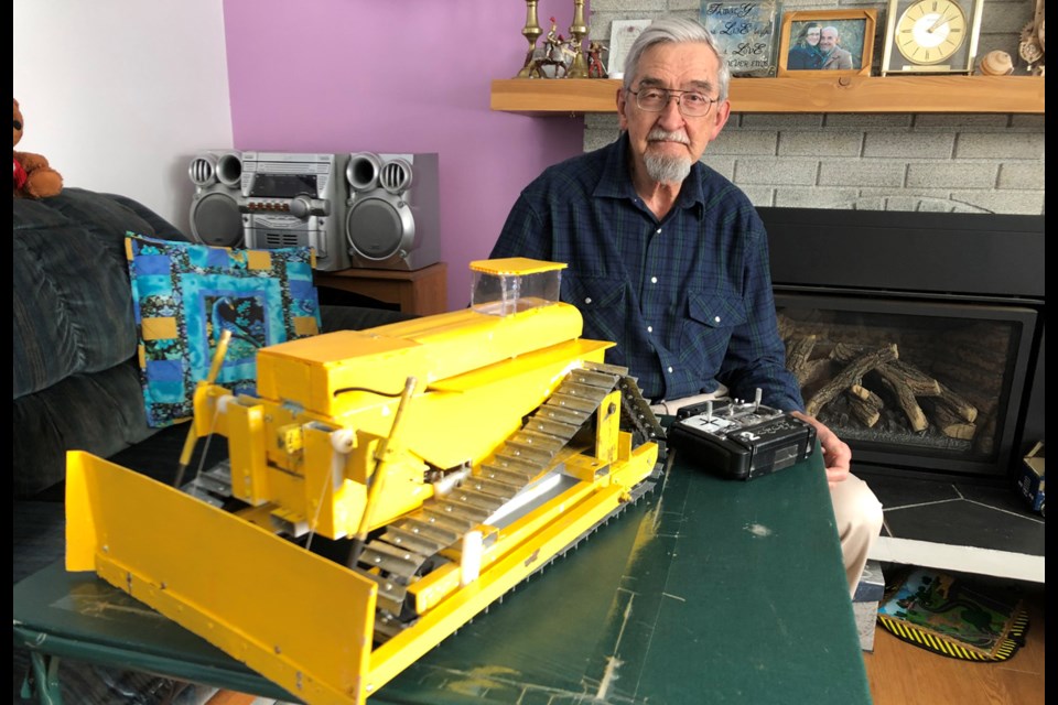 Prince George resident Ron Marwood designed and built a custom RC bulldozer, and uses it to clear snow from his deck and driveway.