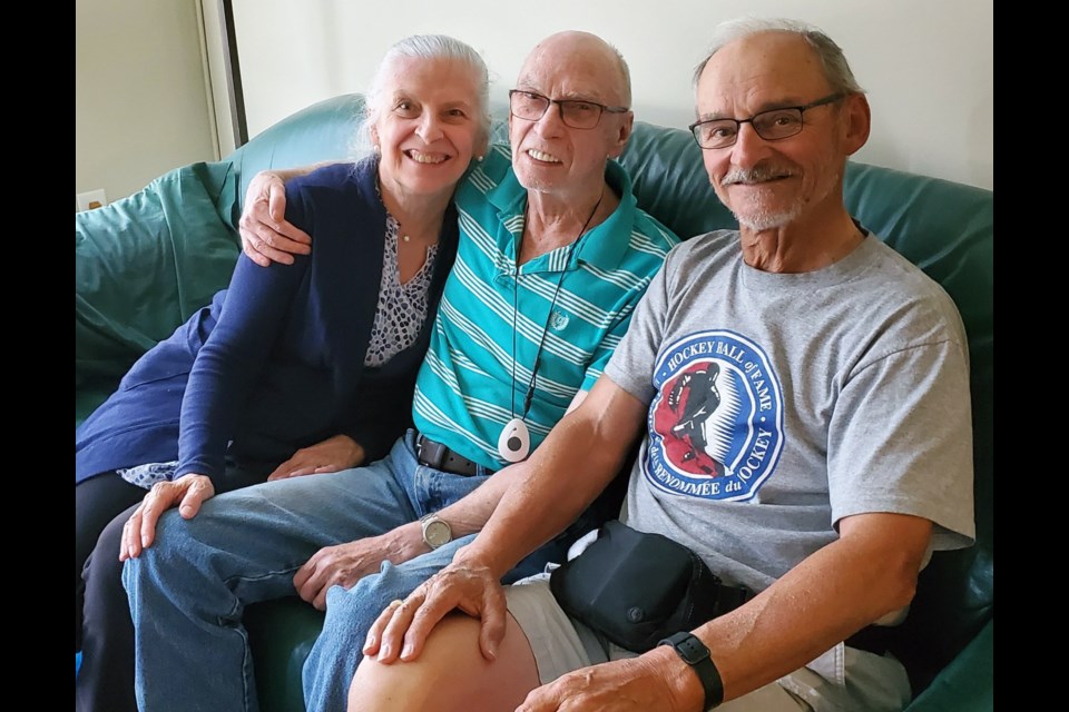 Louise and Richard Lefebvre of Prince George visit with their good friend Jim Owen at his Port Moody apartment. A phone call from hockey legend Bobby Orr resulted in an unforgettable moment for Owen a few weeks ago. 
