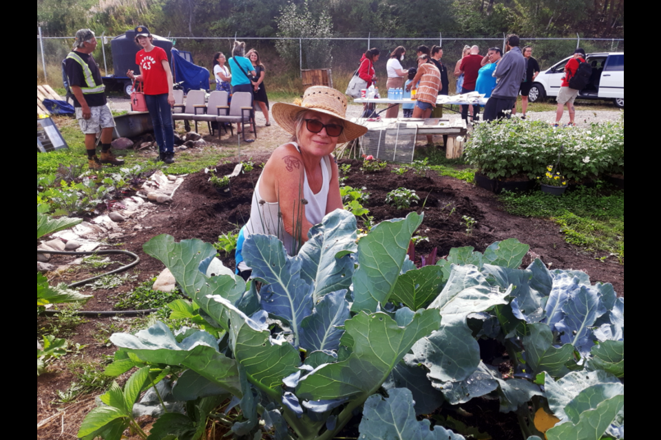 April Ottesen weeds the cabbage patch at the Moccasin Flats garden she and Niki Hanson created to help feed the people living in the downtown Prince George homeless encampment.