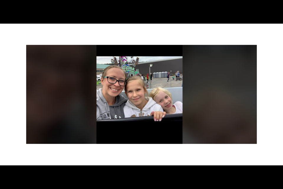 Kat Wolkowski, who has MS, along with her mom, is seen here with her daughters Ava, 13, and Emily, 10.