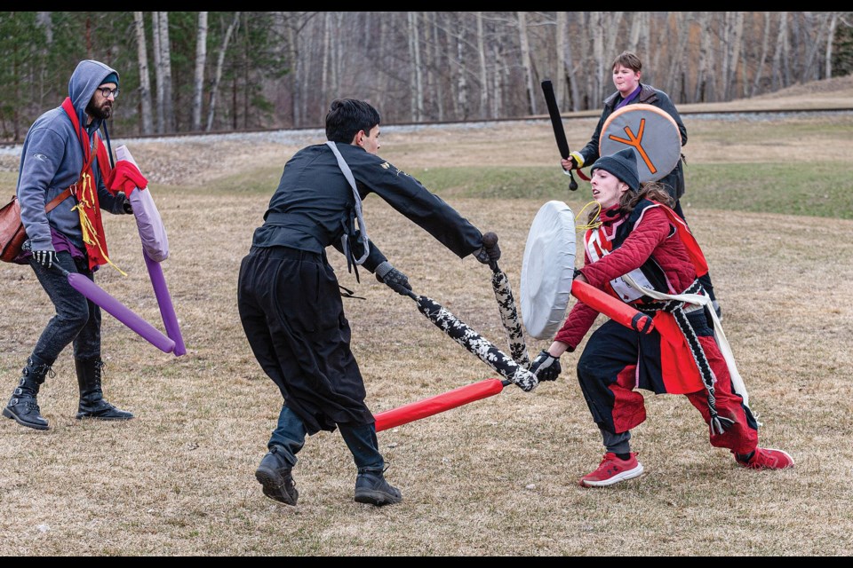 Tenebris ( Mykyl Lekomir, in black) defends from the rushing onslaught of Ronin (Noah Sims) while taking part in a Capture The Flag battle at Lheidli T’enneh Memorial Park Saturday afternoon. The members of Amtgard - Barony of the Northern Grove are a swords-and-sorcery-styled medieval combat, culture, and sciences organization, that have battles with safe foam weaponry.