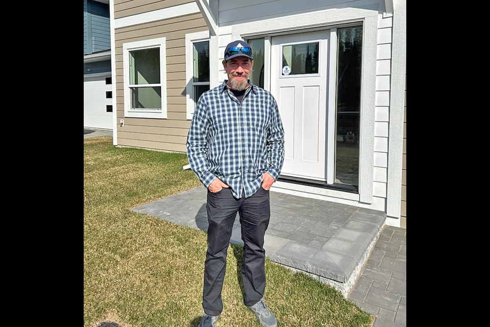 Mark Hippe checks out the $865,000 home he won Friday afternoon as the grand prize winner of the Spruce Kings Show Home Lottery.