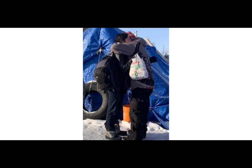 Here community booster Wesley Mitchell hugs one of the people he knows who is unhoused and in need in Mukluk City in downtown Prince George earlier this week during the deep freeze that overtook the city for days.