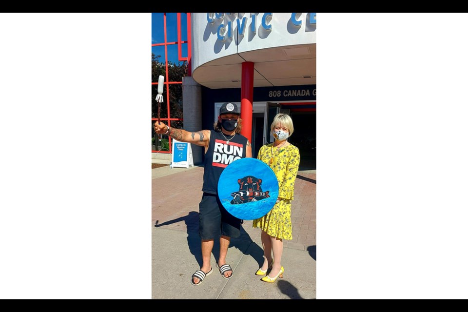 Dr. Bonnie Henry visited the Prince George Civic Centre Tuesday afternoon and is seen here with Wesley Mitchell, Wet’suwet’en First Nation drummer, who honoured her with a song.
