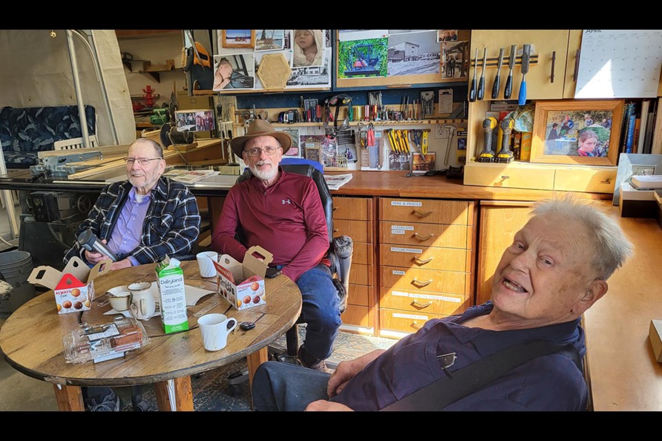 Don Wilkins, left, Larry Merritt and Doug Allen are seen here during their regular Friday morning coffee meeting in Wil Wiens' workshop. The group of men have known each other for as long as 65 years.