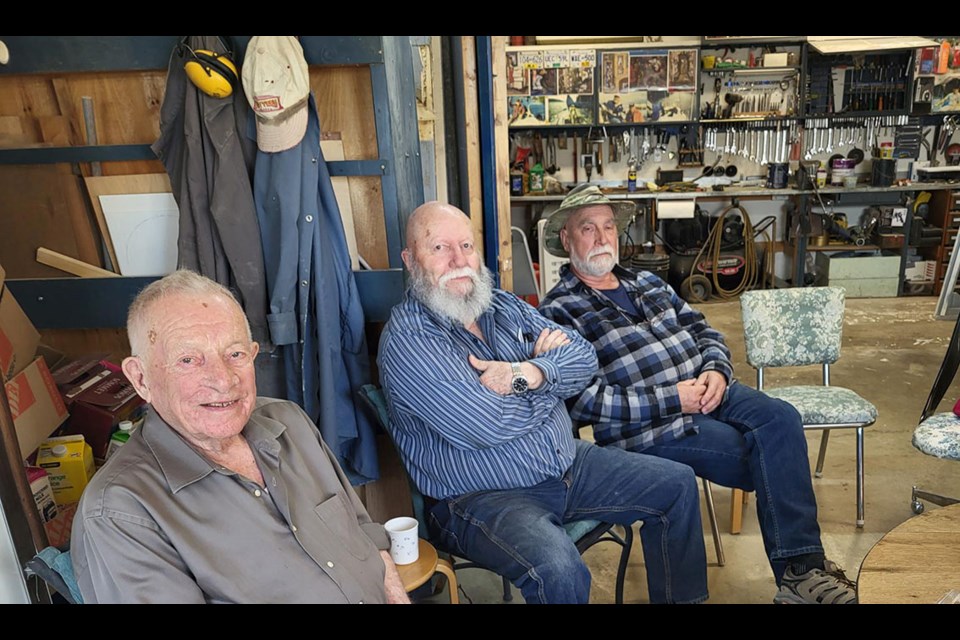 Wil Wiens, 92, former Prince George school principal, has gathered former teachers and students he's known for as long as 65 years for coffee every Friday in his workshop. Beside Wil is Don Wilkins, and Greg Dozda.