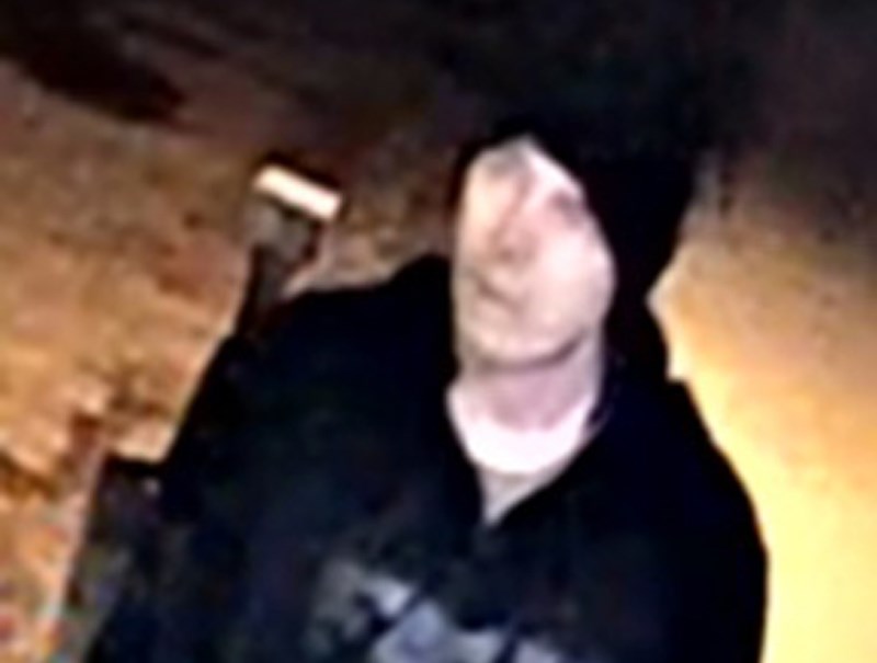 Photo of the suspect wearing a black toque and black FOX hoodie