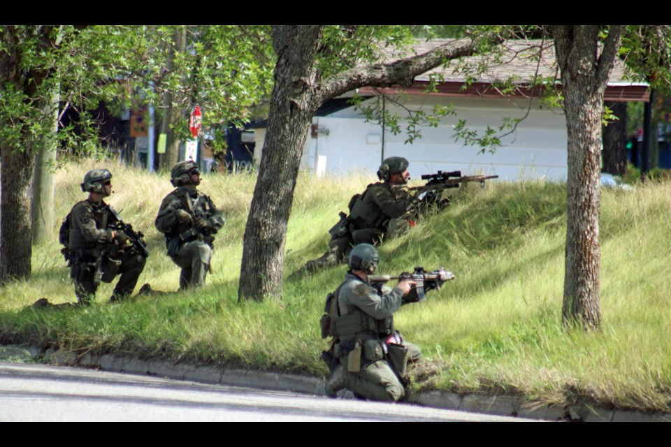 Members of the Prince George RCMP emergency response team on the scene of a standoff at a 2000-block Upland Street home on Monday.