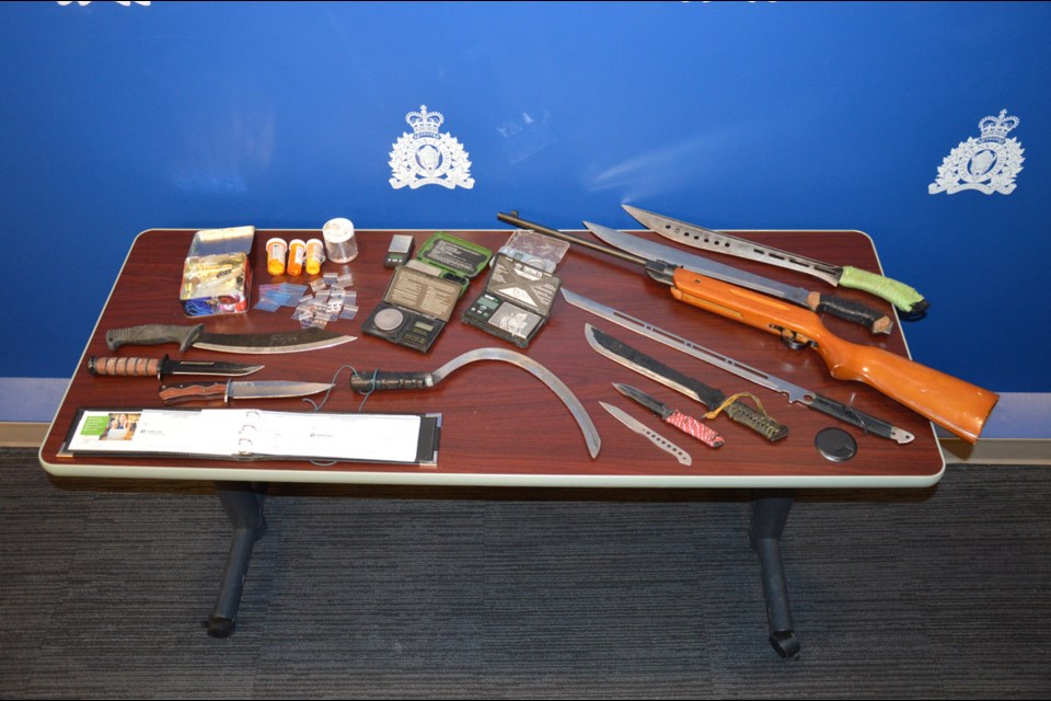 Prince George RCMP seized a variety of weapons and drugs while executing a search warrant at Millennium Park in downtown Prince George on Thursday.