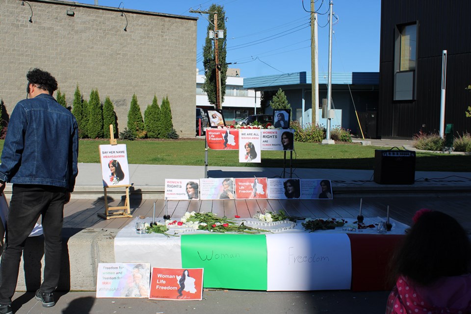 Appropriately seen in shadow and light, there was a memorial at the Wood Innovation Centre's square downtown Prince George during a peaceful protest against the Iran government's regime that saw 22-year-old Mahsa Amini die after being arrested for  how she wore her hijab.