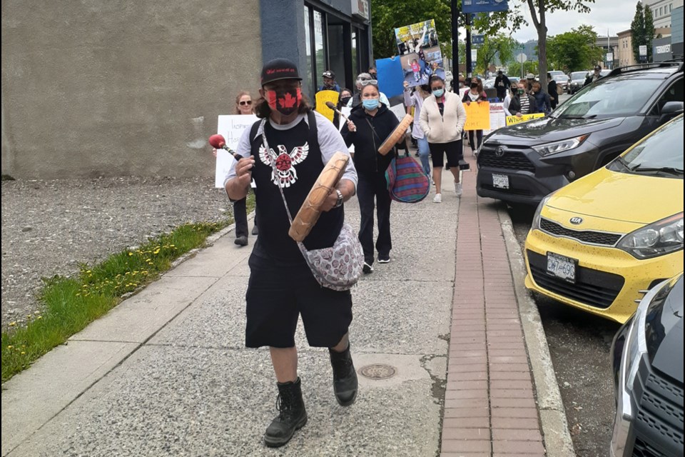 Wes Mitchell, drummer, took the lead during the walk to city hall from the empty lot on George Street across from the Courthouse to raise awareness for the homeless in downtown Prince George.