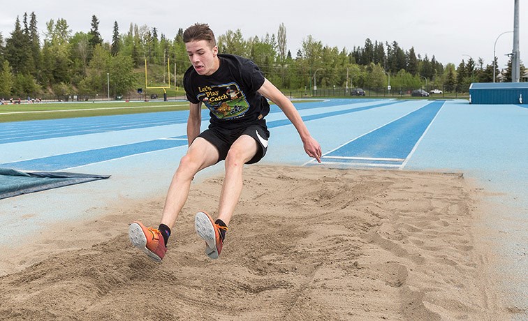 Caleb Emon, 16, shows off his long jump skills during a training session at Masich Place Stadium.