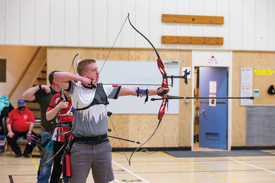Citizen Photo by James Doyle. Archers take aim at the targets on Sunday morning at Silvertip Archers Indoor Range while competing in the Archery Canada Regional Indoor Championships. 