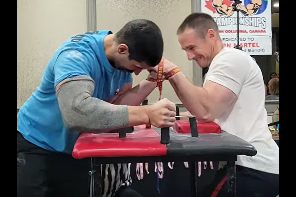 Alex Maritsas of Prince George (let) battles Prince George Iron Arms clubmate Jeff Moleski in the pro 177-198 pound left-hand final at the B.C. arm wrestling championships at Sunday in Kelowna. Moleski won the match.