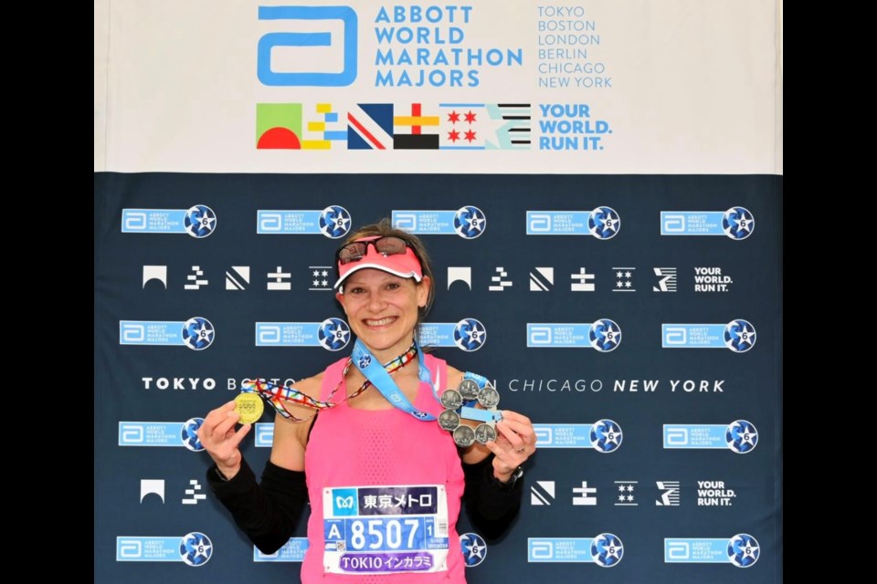 Jacqui Pettersen of Prince George celebrates after receiving her Six Star Medal at the Tokyo Marathon, March 5.