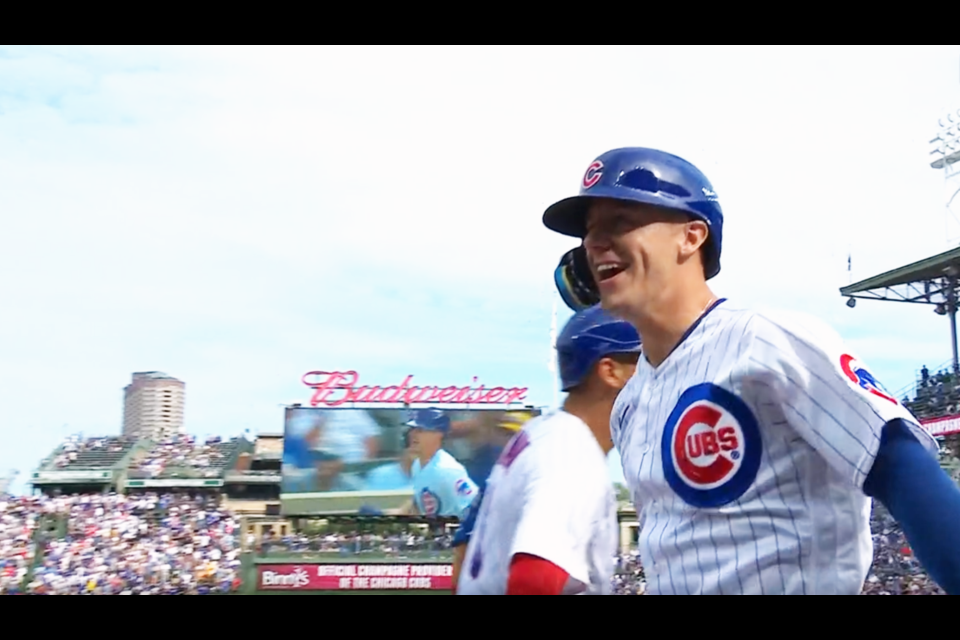 Jared Young of Prince George celebrates his two-run home run in the bottom of the sixth inning against the Colorado Rockies Sept. 22 at Wrigley Field in Chicago.