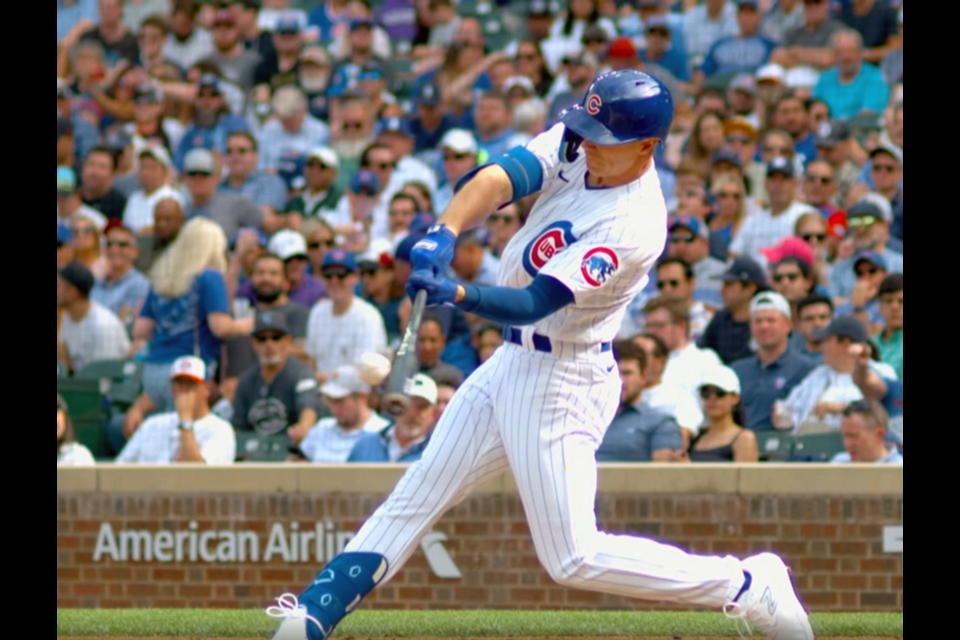 Jared Young of Prince George connects on a two-run home run in the bottom of the sixth inning Sept. 22 at Wrigley Field in Chicago, where the Cubs beat the Colorado Rockies 6-0.