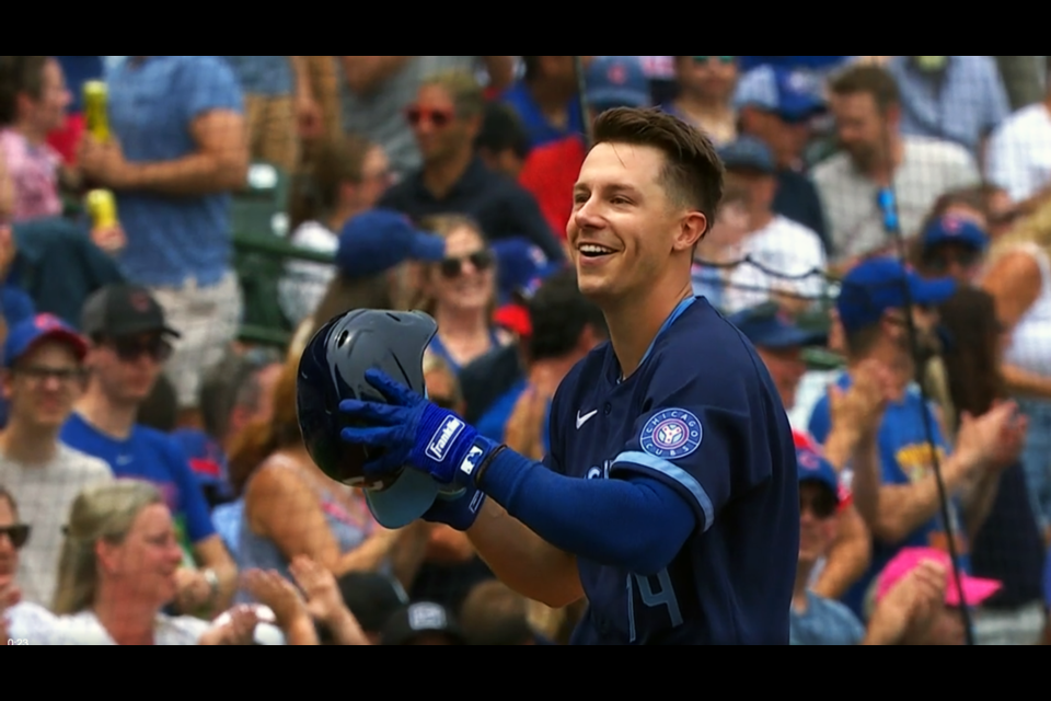 Jared Young of Prince George celebrates hitting a triple in a game June 30 against the Cleveland Guardians at Wrigley Field in Chicago.