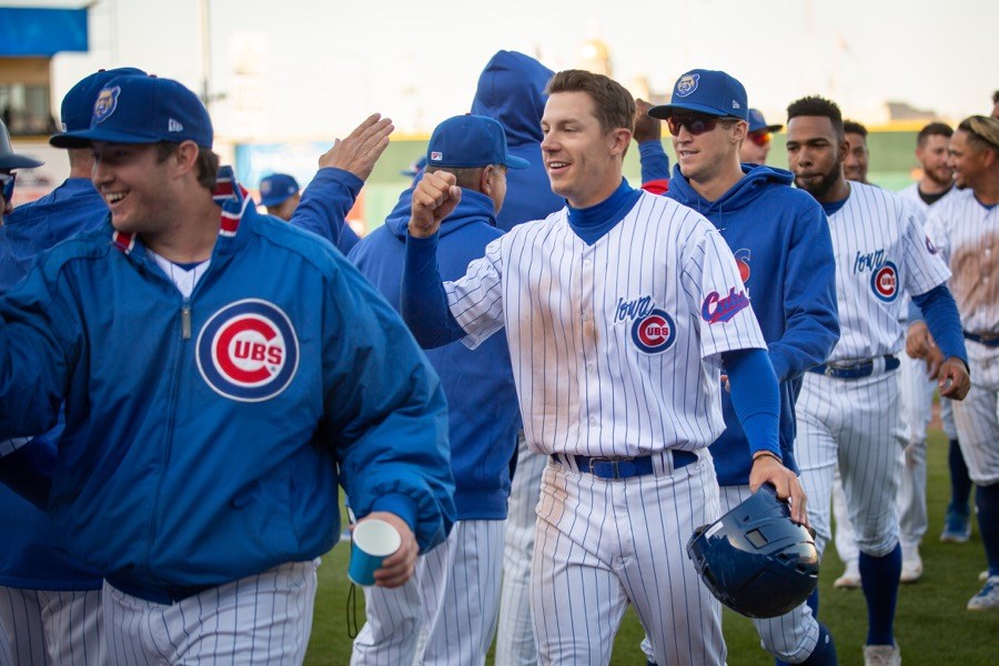  Jared Young of the Iowa Cubs, centre, high-fives teammates after an April 16 game against the Toledo Mud Hens during an International League game at Principal Park in Des Moines, Iowa.