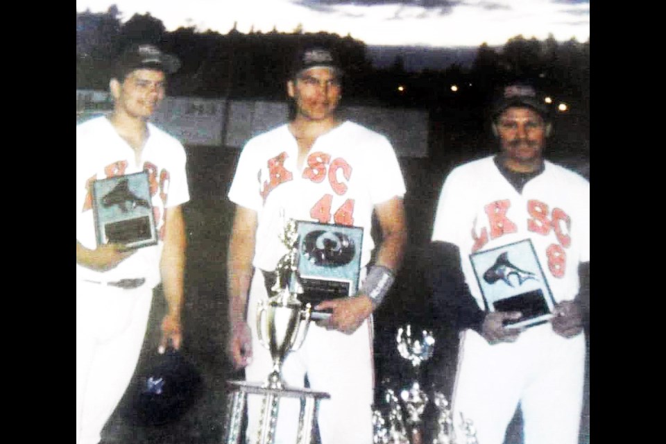 Joey Potskin, centre, poses with his cousins, Chad Ghostkeeper, left, and Randy Potskin after they won the 1999 Canadian Native Fastball Championship.
