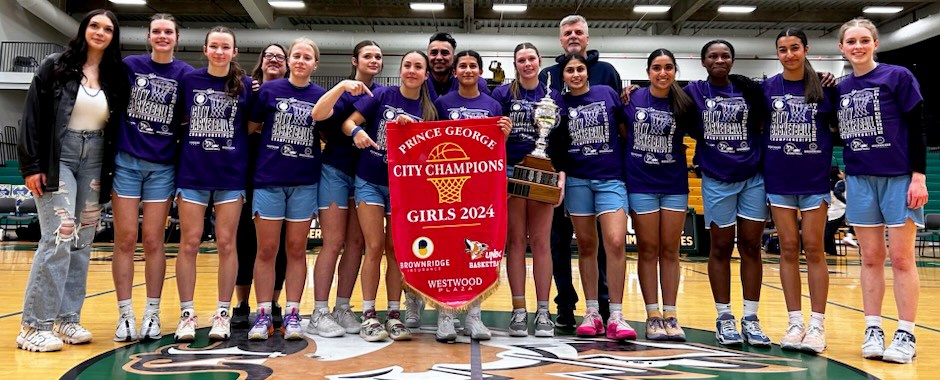 The College Heights Cougars senior girls basketball team celebrates winning the city league championship Tuesday night at the Northern Sport Centre.
