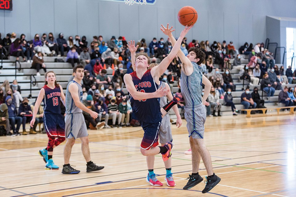 Citizen Photo by James Doyle. The DP Todd Trojans took on the Shas Ti Kelly Road Grizzlies on Friday morning at STKR gymnasium to open the NCDSAA Senior Boys Basketball Zone Championships.